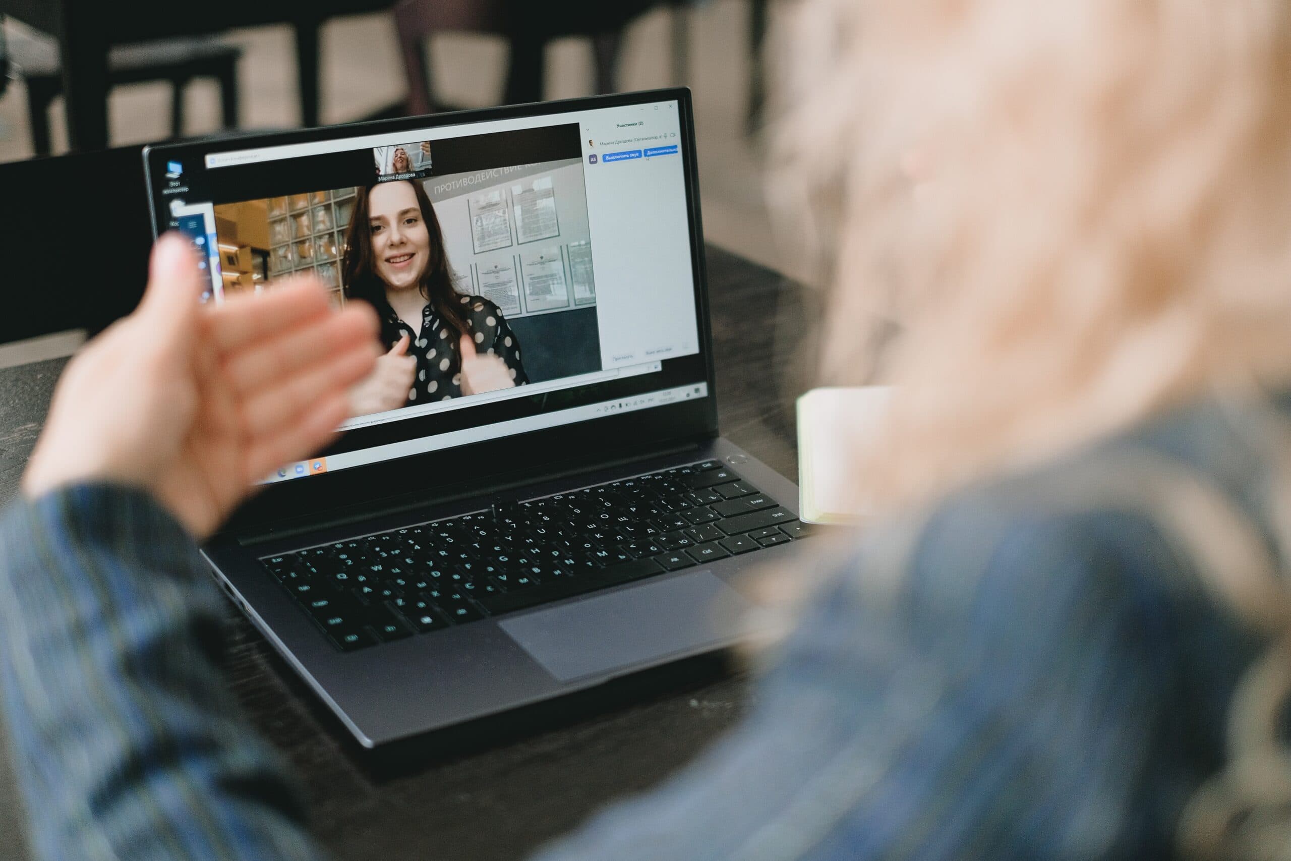 Employee on a video call on their laptop