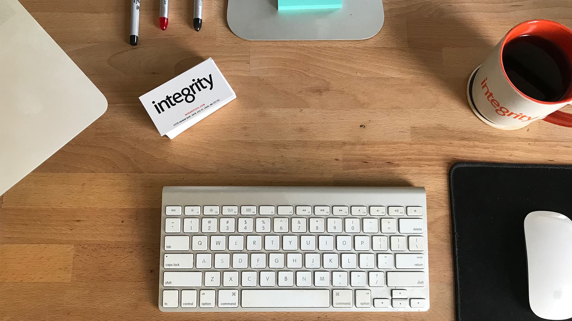 Management featured image with wireless keyboard and Integrity STL business cards